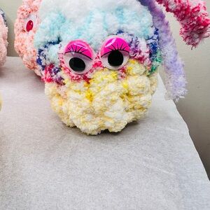 Colorful Plush Toy with Pink Eyes